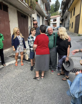 travellers meeting long lost relatives in their ancestral village in Calabria Italy