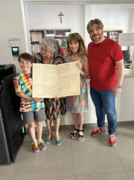 visitora finding birth records of family memebors during ancestry visit in Carolei Calabria