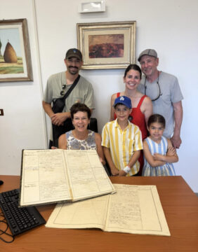 Guests finding copies of family birth certificates at the town hall in Calabria