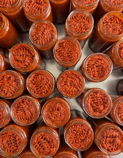 Calabrian salami hanging to cure at a local producer