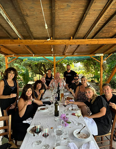 Table of guests sharing a traditional Calabrian meal together