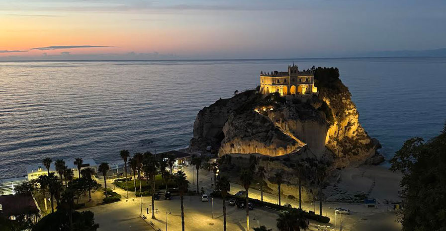 Sunset view of Santa Maria dell’Isola and the Tropea coastline in Calabria, Italy