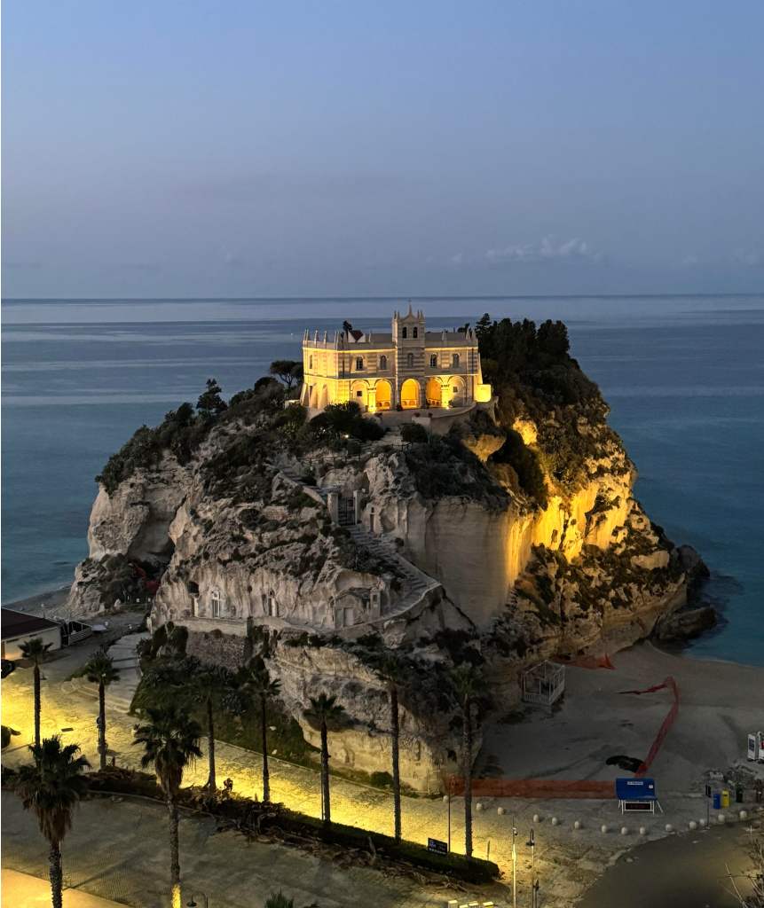 Santa Maria dell'Isola church on the cliff at Tropea, Calabria, illuminated at dusk