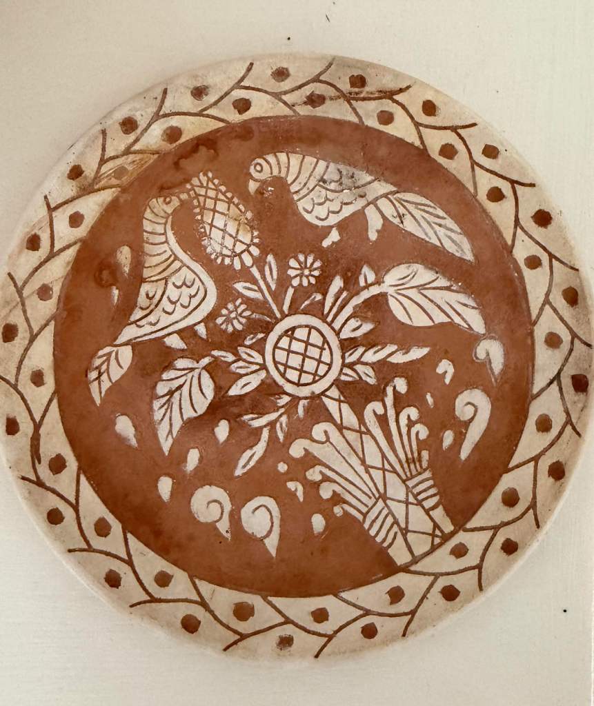 Traditional sgraffito ceramic plate with bird and floral design, Squillace ceramic art Calabria