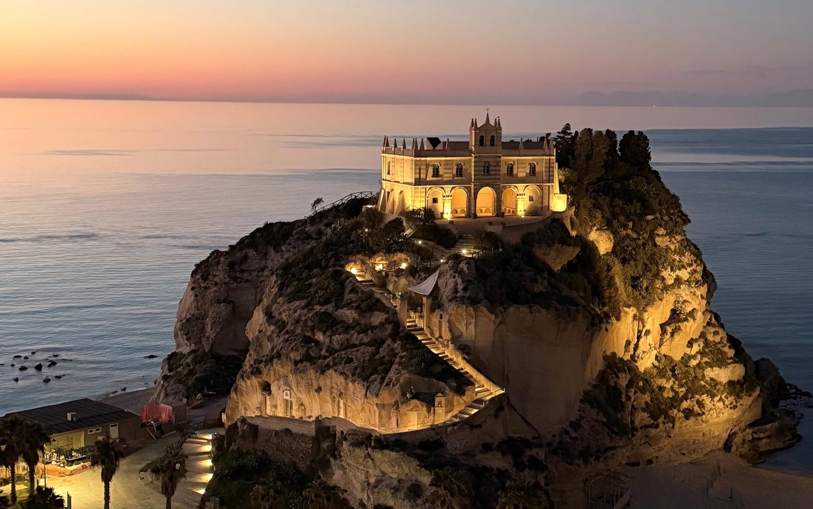 Photo A: Tropea historic centre overlooking the Tyrrhenian Sea in Southern Calabria, Italy at sunset.