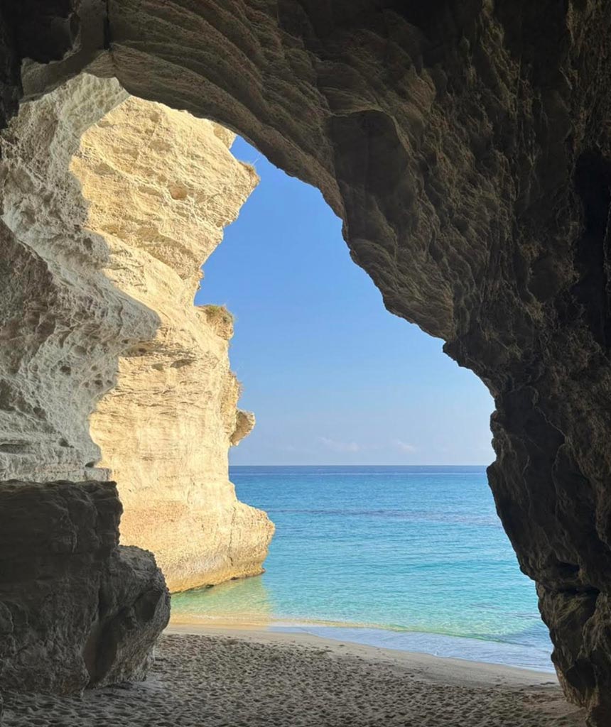 Open sea view along the Calabrian coastline during a yacht excursion